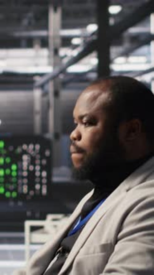 Vertical Video Exhausted Server Farm Employee Stretching Back