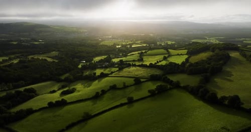 Beautiful Farm Land And Forests In Early Morning Sun Aerial Drone Shot
