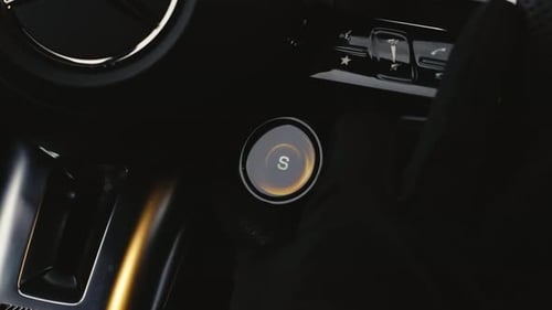 Person use fingers turn round knob on steering wheel to change driving mode