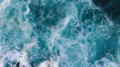 Aerial View of Turquoise Ocean Water and Foaming Waves