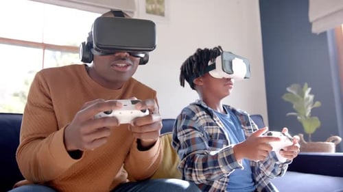 Father and Son Playing VR Games at Home