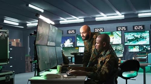 Men Monitoring High Tech Computer System