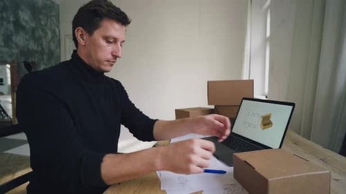The Designer Works on the Packaging Design Using a Computer
