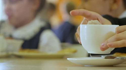 Students Eating Lunch at School Cafeteria Table