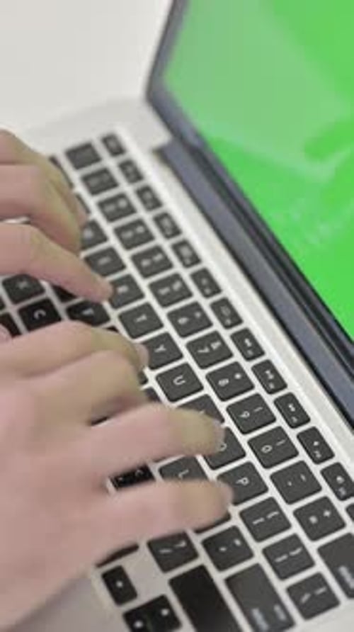 Close Up of Typing on Laptop, Chroma Key Screen, vertical video