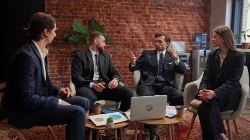 Professional Business Meeting with Four Colleagues in Modern Office