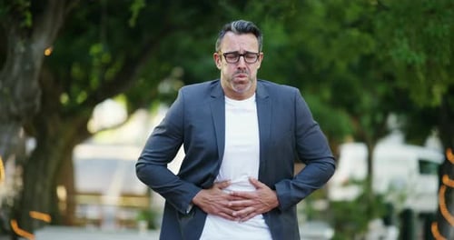 Business man, stomach pain and outdoor on street, sick and medical problem in city