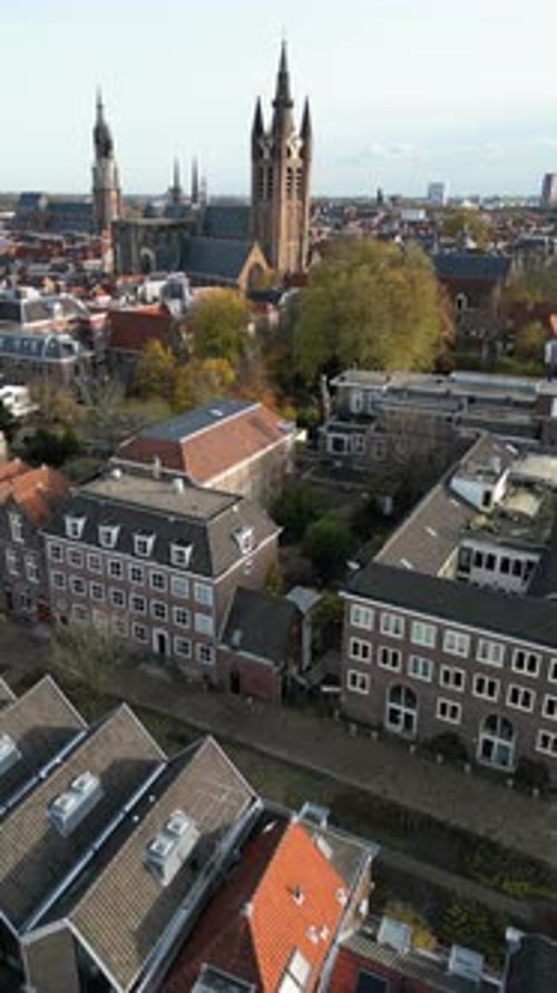 Aerial drone view of the Nieuwe Kerk Protestant church in the city of Delft in the Netherlands. Vert