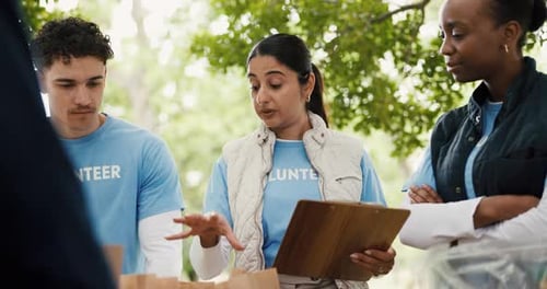 Volunteers, donations and people with clipboard, park and listen to organizer for community service