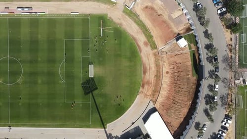 Aerial video of soccer players playing in the stadium, Kfar Saba Israel