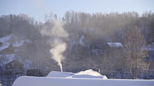 Winter Landscape With Smoke Rising From Chimney
