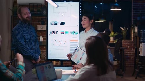 Diverse Coworkers Presenting Company Annual Investment Profit Report