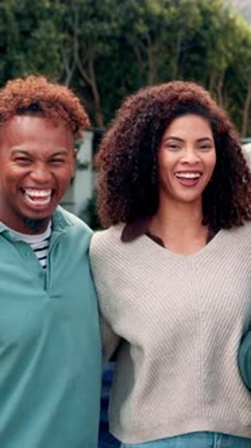 Smiling Family Grouping Together in Urban Setting