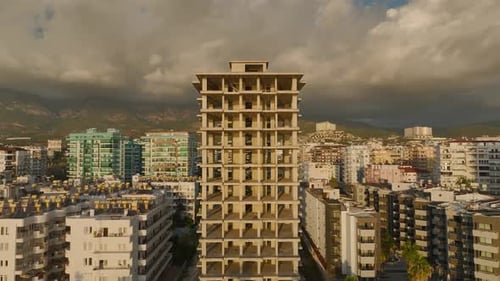 Aerial View The Skeleton of a Highrise Building Stands Tall on the Beachfront Promising Stunning