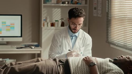 Doctor Using Insulin Pen on Patient Stomach