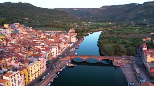 Aerial of Bosa Stunning Coastal Landscape and Historical Architecture in Sardinia at Sunset