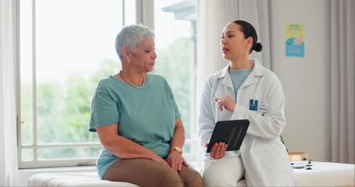 Doctor, patient and tablet with consultation in clinic, technology and medical history discussion