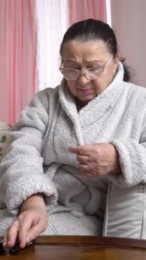 Woman Manages Health with Medical Pen at Home