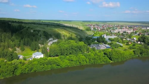 Aerial view of a village located by the river shore