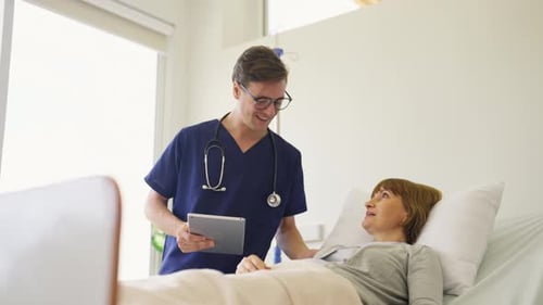 Caring Nurse Visits Female Patient in Hospital Bed