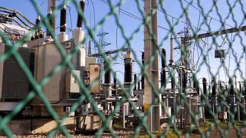 A view into the power plant through a protective fence