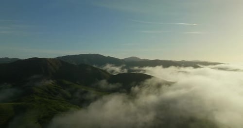 Peaked mountain peak in swirling clouds