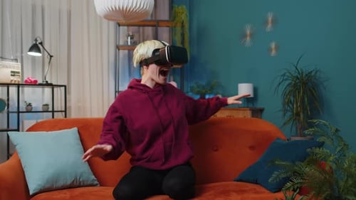 Young Adult Using VR Headset on Couch