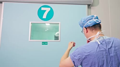 Medical Professional Enters Hospital Operating Room
