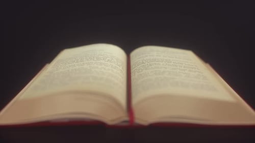 Open Book with Text Pages on Dark Background