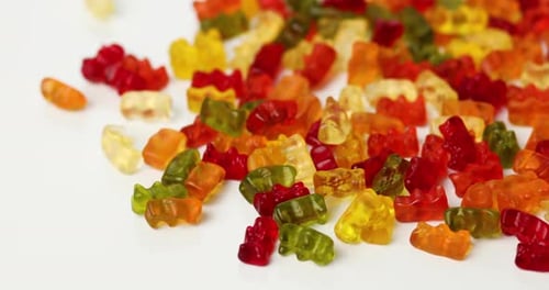Pile of colorful gummy bear candies close up