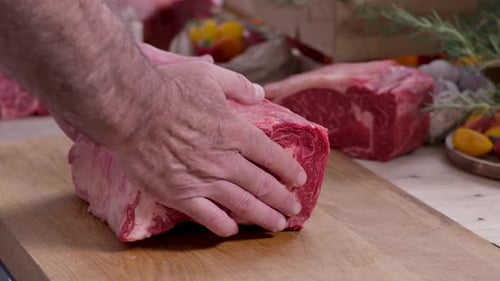 Butcher Preparing a Fresh Cut of Beef Roast