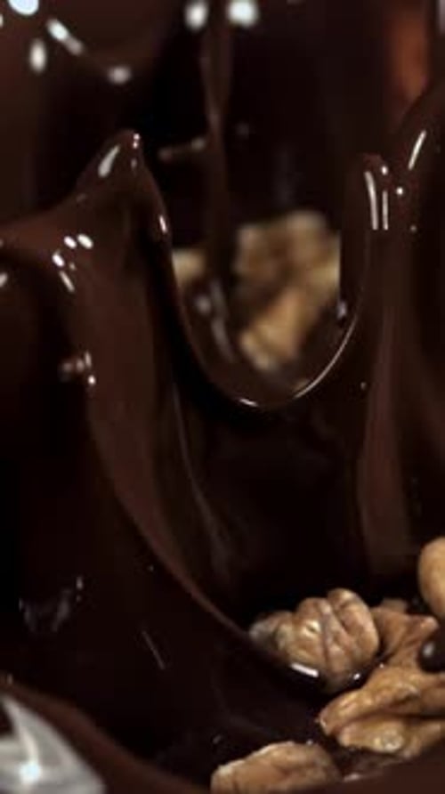 Walnuts Fall Into Liquid Chocolate Filmed on a Highspeed Camera at 1000 Fps