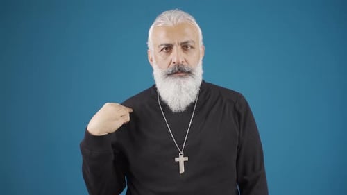 Man with Beard Making the Sign of the Cross