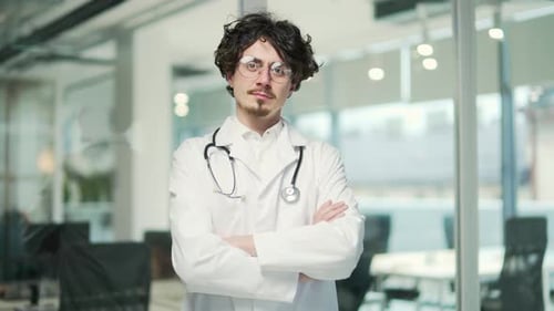 Young Doctor Stands Confidently in Modern Office