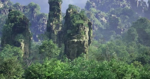 Majestic Rock Formations Rise Above Lush Greenery in a Serene Landscape