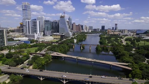 Aerial view over bridges on the Colorado river in Austin city, sunny, summer day in Texas, USA