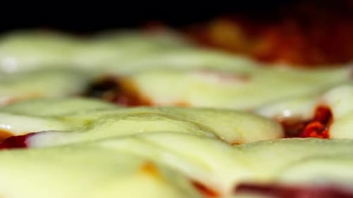 Bubbling Cheese Pizza Baking in Oven