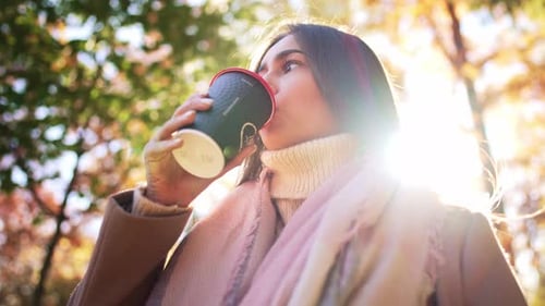 Portrait Caucasian Charming Lovely Dreamy Lady Hand Hold Glass Coffee and Enjoy Drink in Autumn Park