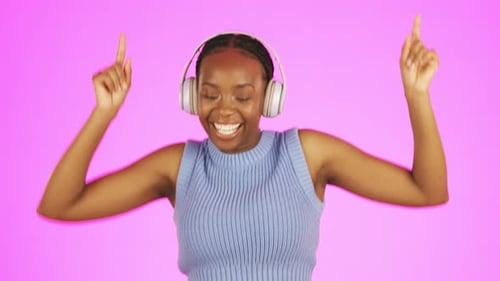 Black woman, dancing and headphones listening to music in celebration for winning