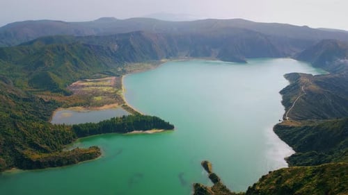 Aerial Volcanic Island Lagoon in Morning Rippling Turquoise Water Wash Rocky
