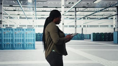 Manager in Data Center Using Tablet to Deploy New Server Architecture