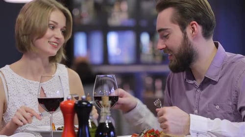 Beautiful Couple Having Romantic Dinner at Restaurant