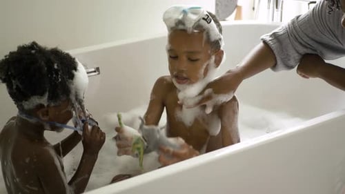 Children Taking a Bath with Toys and Bubbles