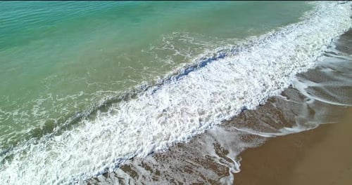Aerial View of the Sea Waves Rolling Down on the Sand of Tropical Beach