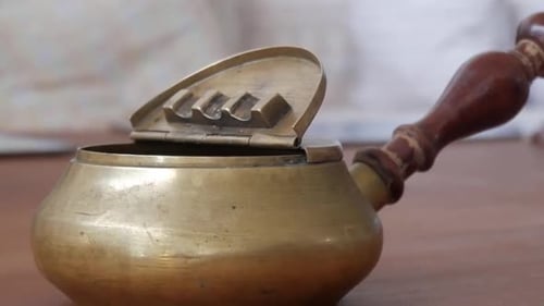 Antique Bronze Ashtray with Wooden Handle Close Up