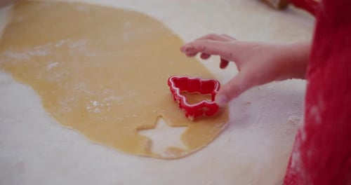 Close Up Of A Boy Making Gingerbread Cookies And Shaping Them In The Kitchen