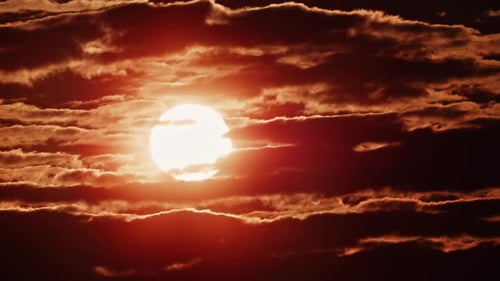 Time Lapse of Glowing Sunset Through Clouds