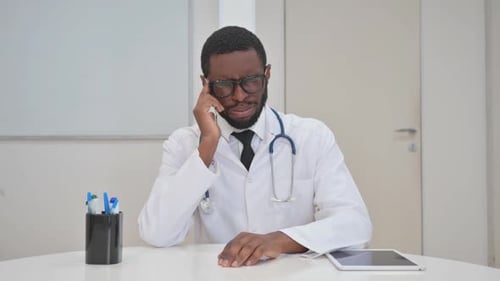 Adult Man Doctor with Headache Takes Off Glasses