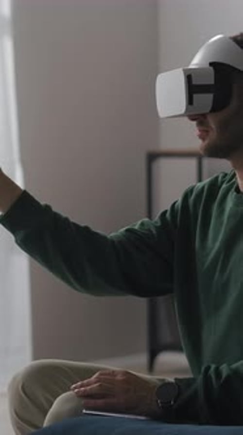 Man Using Virtual Reality Headset in Bright Room