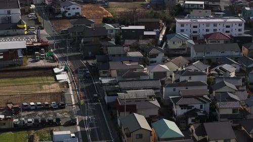 Forwards Fly Above Street and Family Houses in Residential Suburb High Angle View of Dense Town